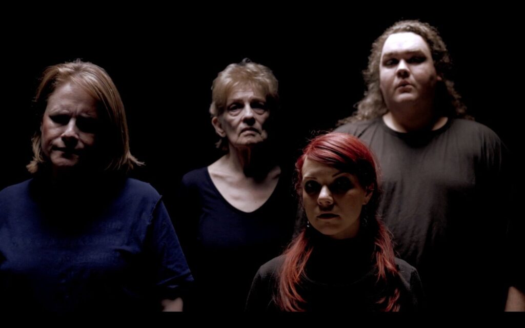 The Who’s Hamlet cast in dramatic stage lighting